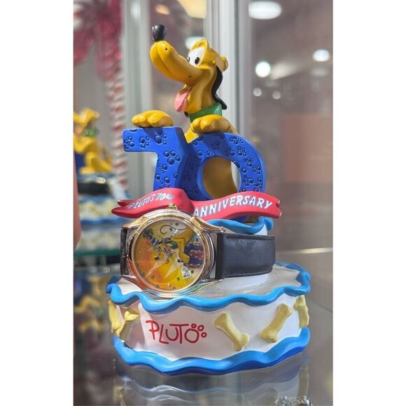 Pluto\'s 70th Birthday watch and sculpture.